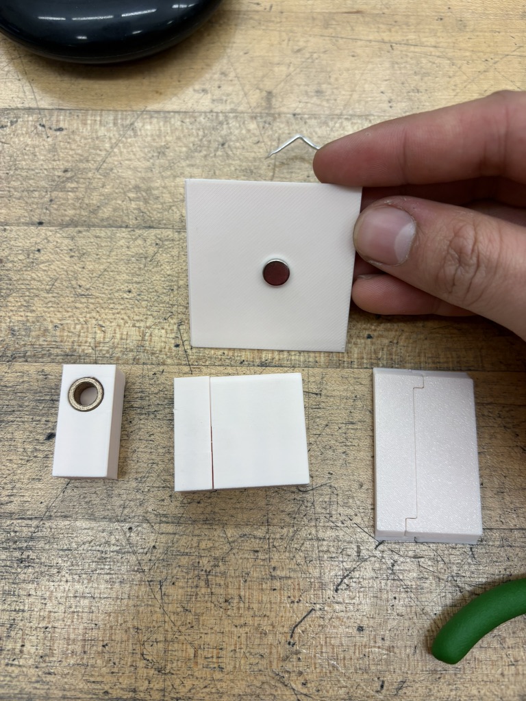 3D-printed insert and joining pieces being tested by hand