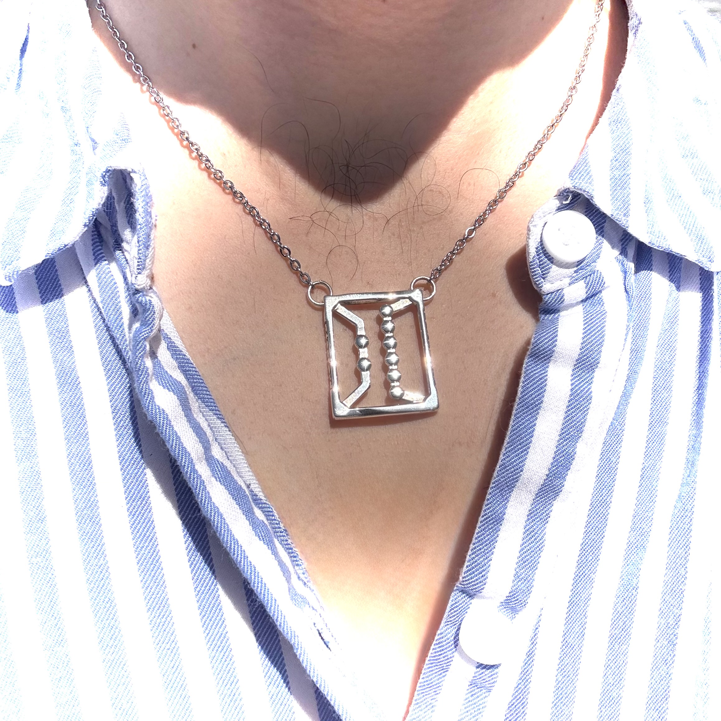 Sebastian Esteva wearing the finished graduation pendant
